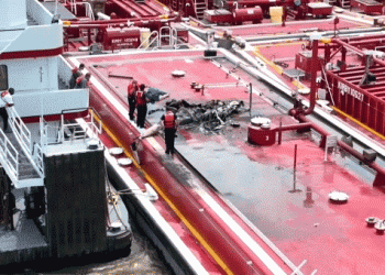 Two people killed after helicopter hits power line and crashes into barge on Mississippi River