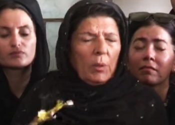 Who threw eggs at Aleema Khan?