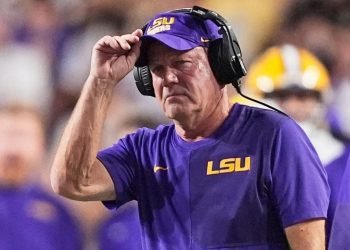 LSU, Florida players steamroll coach Brian Kelly on sidelines