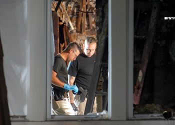 Couple found tied up and burned to death in home near famous racetrack as police hunt for suspect