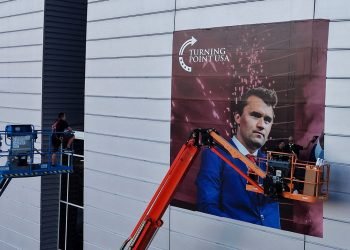 Man detained at Kirk memorial site was allegedly found with gun, knife and expired credentials inside stadium